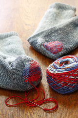 darning socks, repairing holes in socks