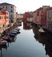 Fototapeta na wymiar Wide canal in Chioggia Island near Venice in Italy
