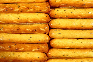 long cookies with poppy seeds close up