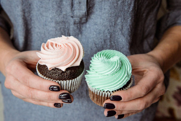 Tasty cupcakes on background table. Homemade chocolate muffin cupcake with cream buttercream icing. Birthday cupcake. Valentine cupcake sweets. Close up view delicious sweet dessert