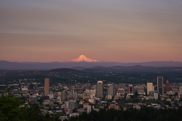 Portland Oregon skyline with Mt Hood backdrop during sunset