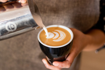 The making of a Cappuccino with beautiful foam art