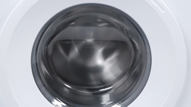 An empty washing machine is working.