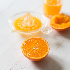 sliced orange half on wooden table