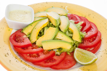 delicious salad avocado, tomato and lettuce