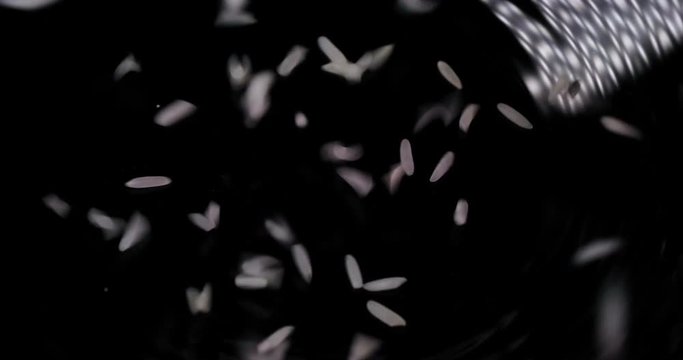 White rice on a black background.