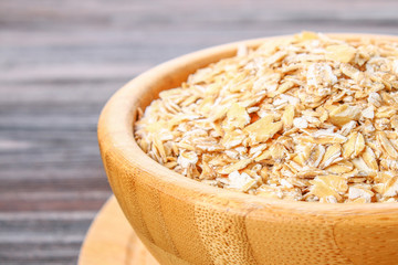 oat flakes on wooden table.healthy food concept.