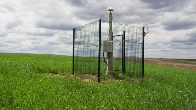 Seismological Equipment among Fresh Green Field