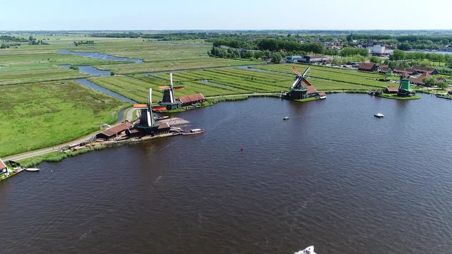 Aerial windmills of Zaanse Schans neighbourhood of Zaandam near Amsterdam Netherlands it has collection of well-preserved historic windmills and houses and is one of the popular tourist attractions 4k