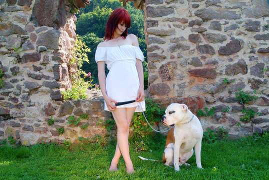 Red haired woman with her dog
