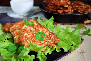 Vegetable pancakes on lettuce leaves. Vegetarian meal