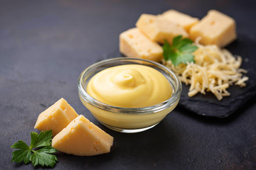 Homemade cheese sauce in glass bowl