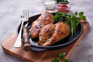 Grilled chicken breast or fillet on iron pan