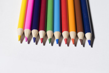 Colorful group of color pencil laying on the table.