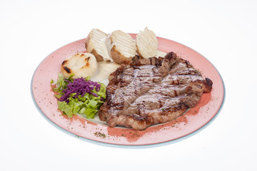roasted beef steak with steamed potatoes and salad