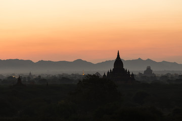 Silhouette of the ancient temples in the archaeological park in Bagan before the sunrise, Myanmar
