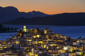View of Poros island and mountains of Peloponnese peninsula in Greece. 
