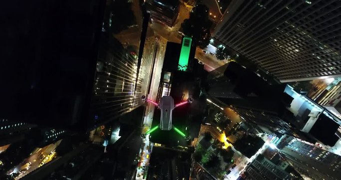 AERIAL. Animation of Drone Multi-rotor flying above the city panorama at night scene.