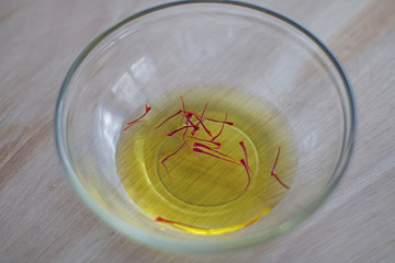 Saffron pistils soak in water.