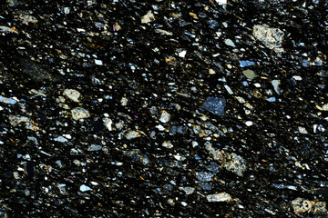 Colorful micro crystals of rock in polarized light.