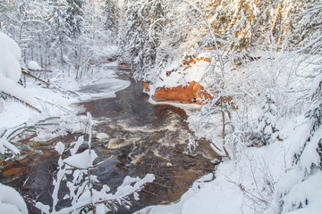 Red cliffs and river Amata at Cesis. 2013