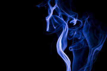 Blue smoke on black background
