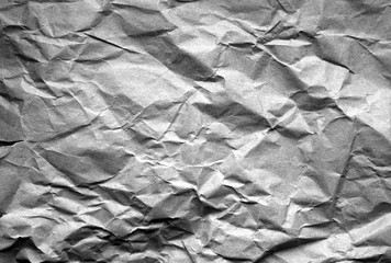 Old paper with wrinckles in black and white.