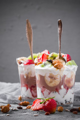 Yoghurt fruit dessert strawberries banana kiwi raisins sunflower seeds oatmeal walnuts caramel