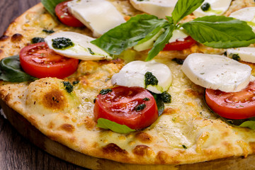 Pizza Caprese with basil