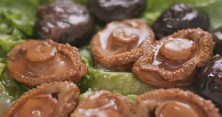 Pouring sauce on abalone, Chinese dish for lunar new year