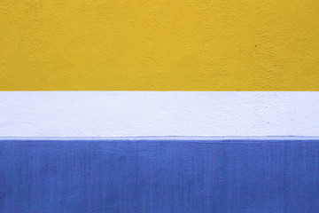 Freshly Painted Blue, White and Yellow Wall Background
