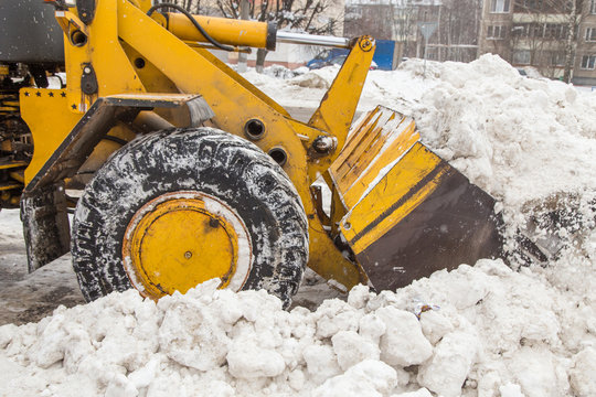 Tractor Sweeper Plowing The Snow After Snowstorm And Blizzard