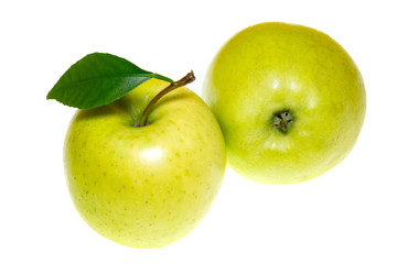 Two green apples with leaf isolated on white