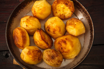 Fried potatoes on a wooden board
