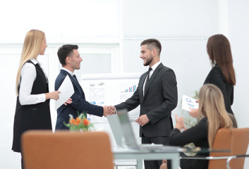 handshake business partners before a business presentation.