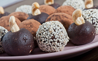 Oriental sweets from sesame on an old wooden background.
