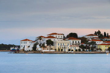 Fototapeta na wymiar Evening view of Spetses village from the harbour pier, Greece. 