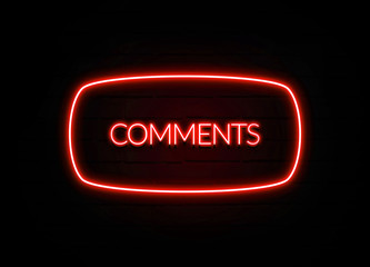 Comments neon sign on brick wall background.