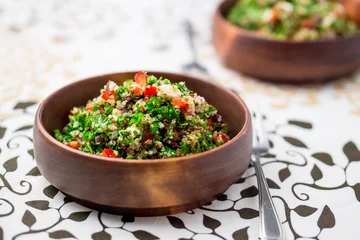 Foto auf Acrylglas Fertige gerichte Healthy vegetarian salad bowl. This healthy dish mixes tabbouleh & greek style salads, using fresh parsley herb, olives, onions, feta and replacing the bulgur usually found in tabouleh with quinoa.