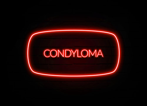 Condyloma neon sign on brick wall background.