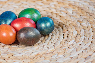 Easter coloured eggs on old basket