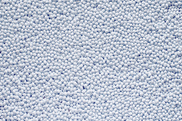 Polymer additive in granules, background texture