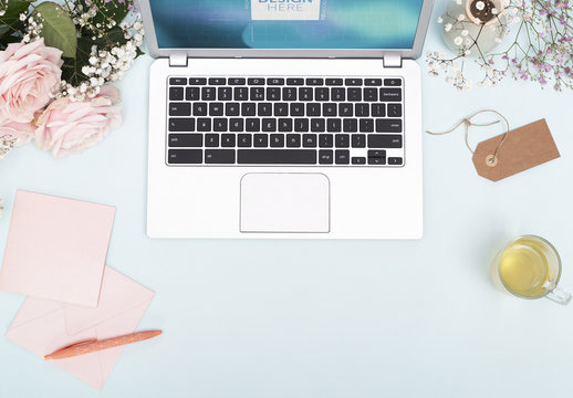 Laptop with Flowers and Stationery Mockup 1