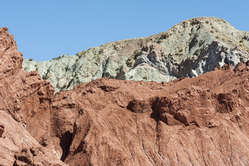 Fototapeta premium Rainbow Valley (Valle Arcoiris), in the Atacama Desert in Chile. The mineral rich rocks of the Domeyko mountains give the valley the varied colors from red to green.