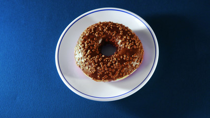 Colorful donuts on stone table. 