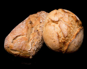 bread roll, bread on a black background, isolated