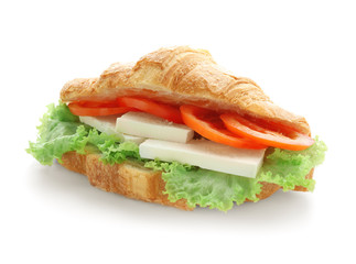 Tasty croissant sandwich on white background