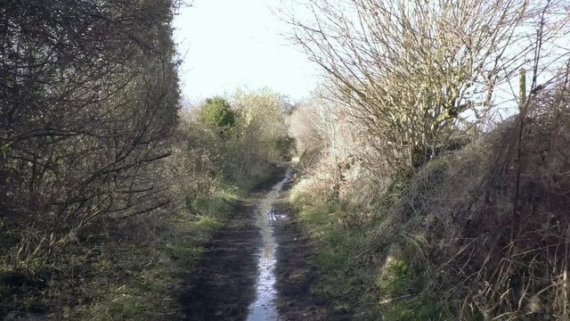 Part 2 of 4. Ride through empty countryside walking track. Wet ground with mud and puddles.  Baker Path, Tarvin, Cheshire, England