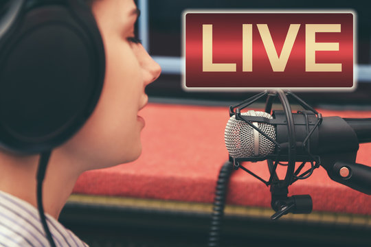 Young woman taking part in live radio broadcast at modern studio