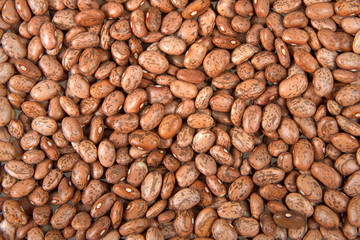 Flat view from above of many pinto beans